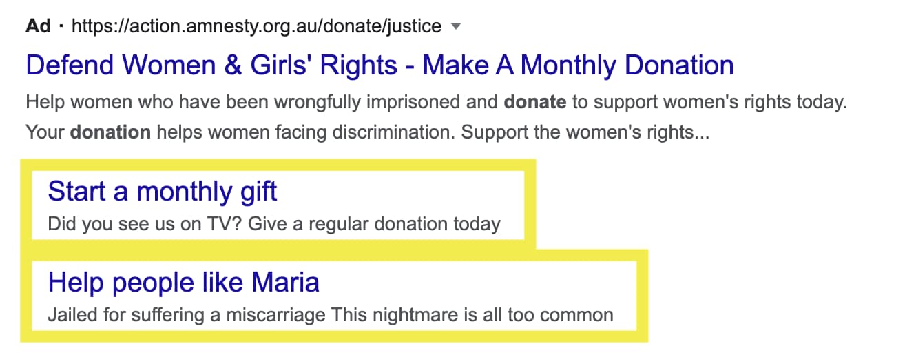 Sitelink extension example for Google Ad Grant. Search ads is for Amnesty Australia and contains two expanded sitelinks. 